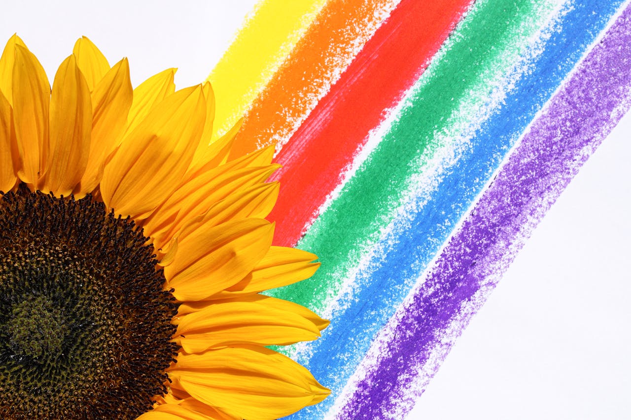 A bright sunflower with vibrant rainbow colors, symbolizing joy and diversity.